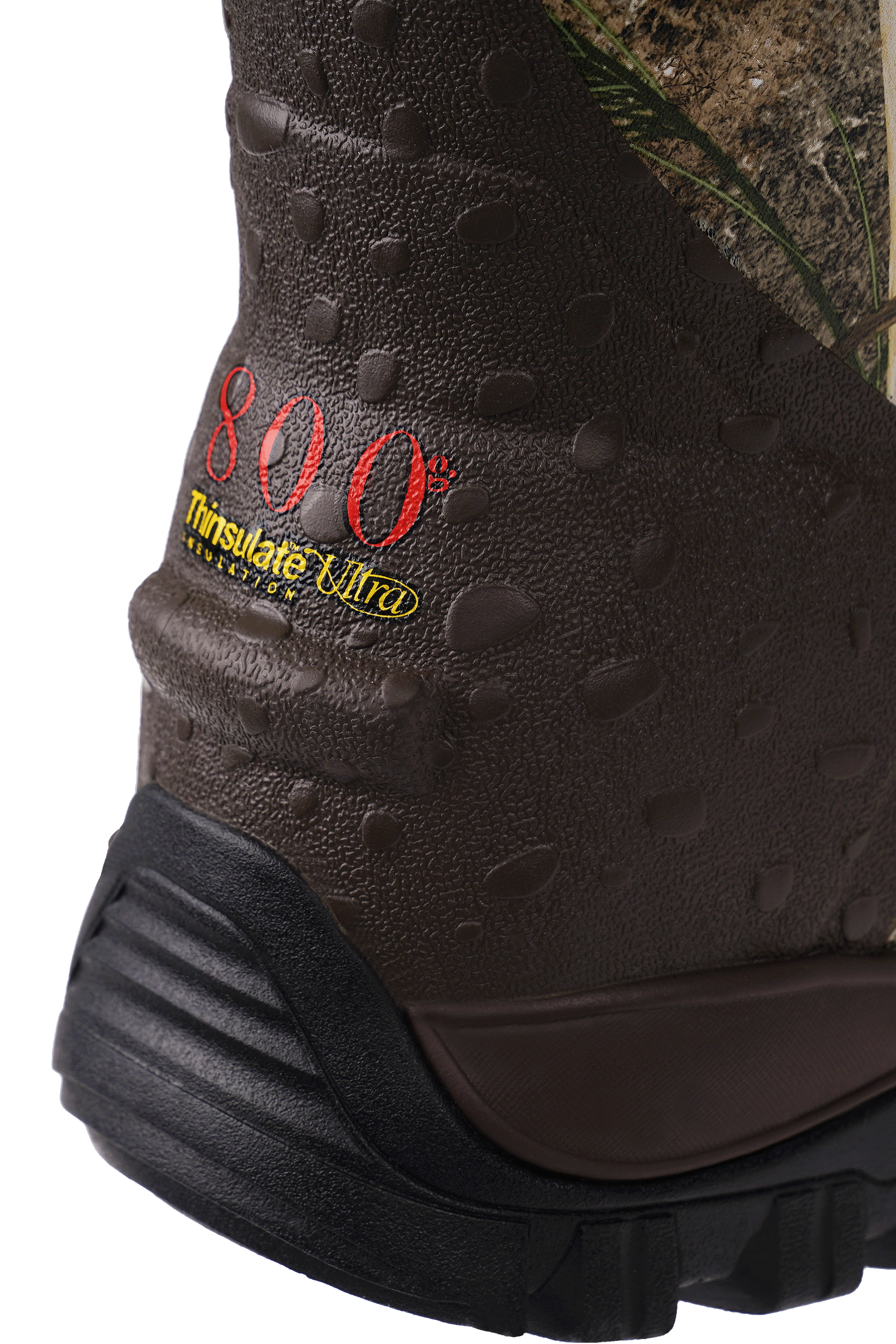alt="Close-up of the heel area on Trudave WildGuard Series men’s tall waterproof camo hunting boots in Reed Grass color showing small rear kick lug for easy removal, reinforced heel design, and durable waterproof construction built for traction and stability in outdoor hunting terrain"